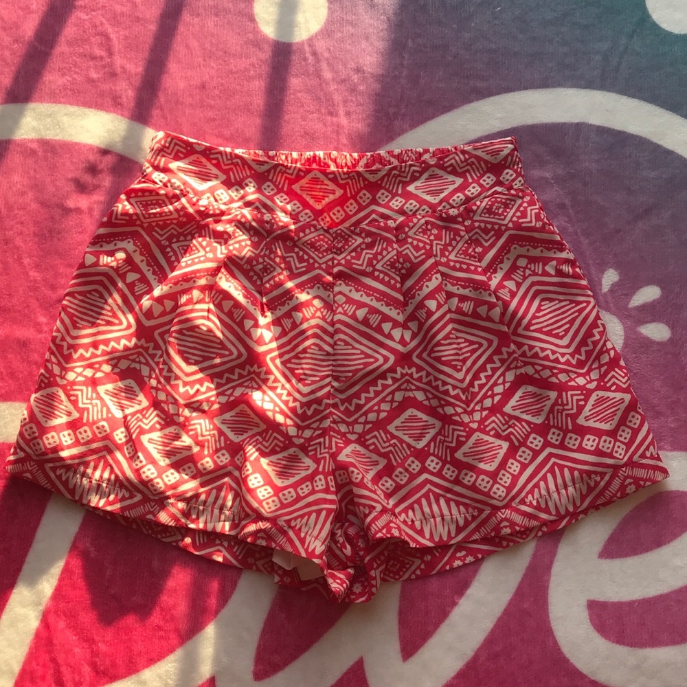 Pink patterned flowy summer shorts.